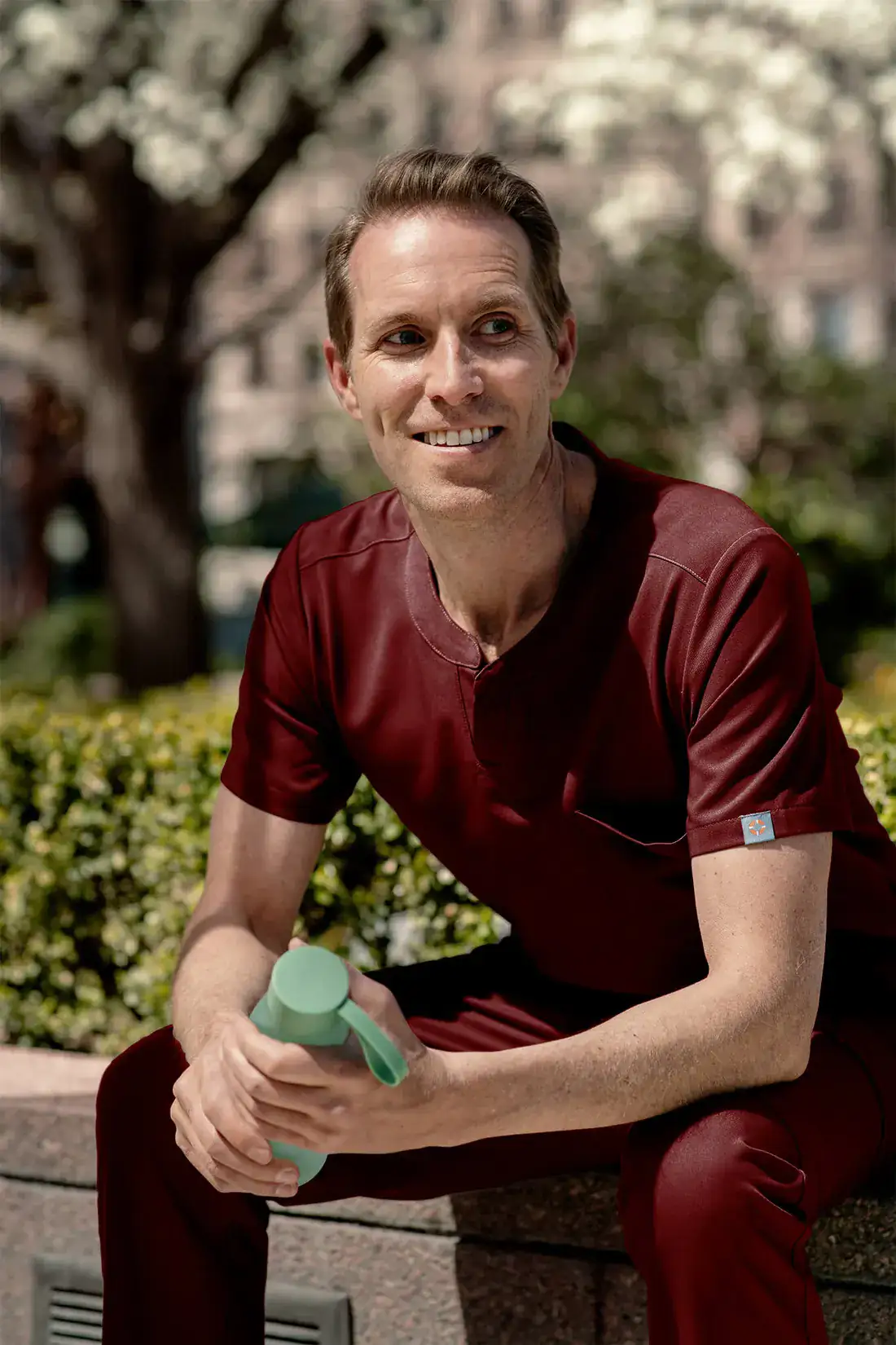 Man in a Merlot Red MedTailor scrub set